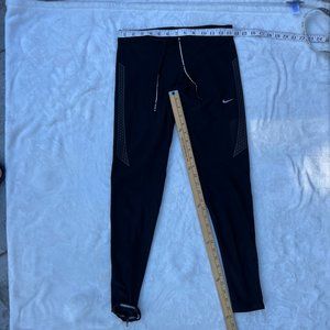 Nike dri fit running tights with reflective detail and zipper size S.